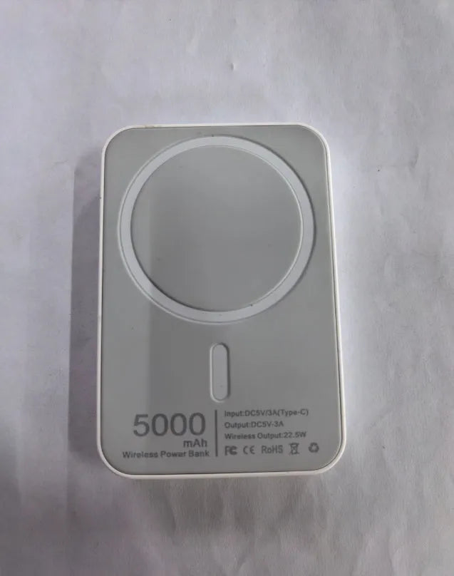 Portable wireless power bank with magnetic charging in pink, purple and white colours showing 5000mAh capacity