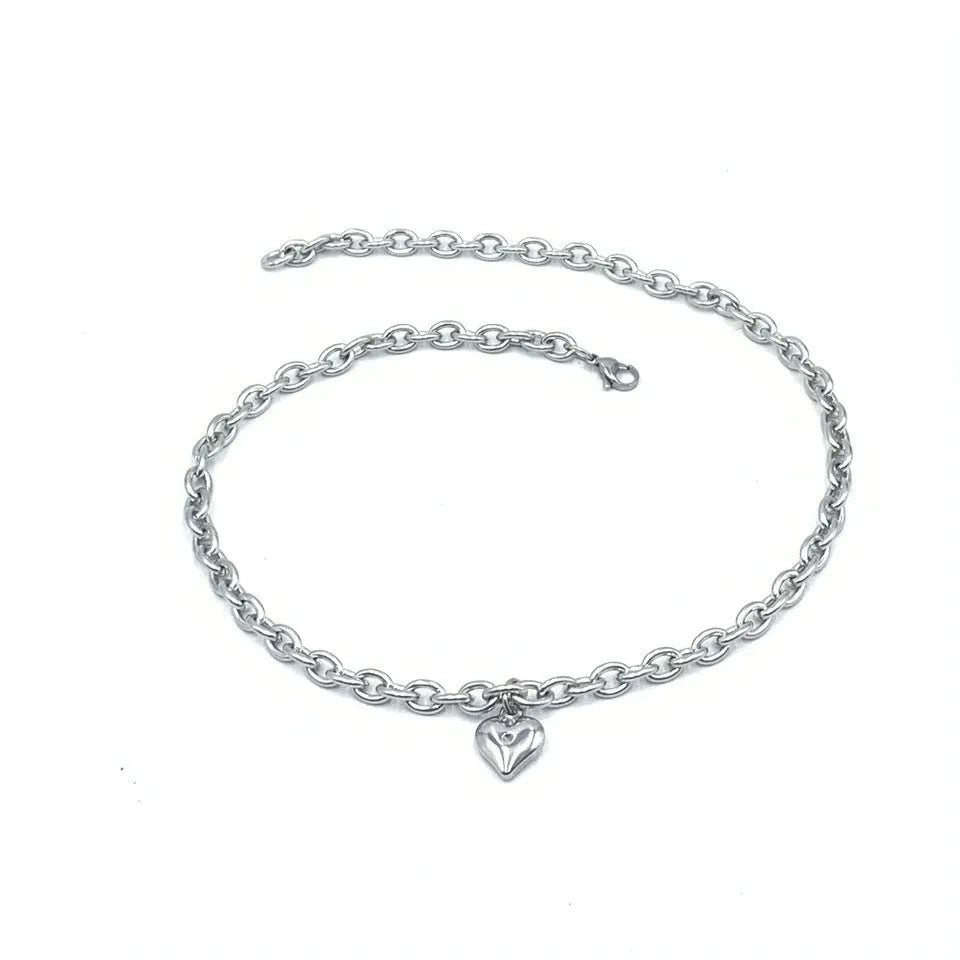 Stainless steel necklace with a love heart pendant showing an animal design, on a curb chain.