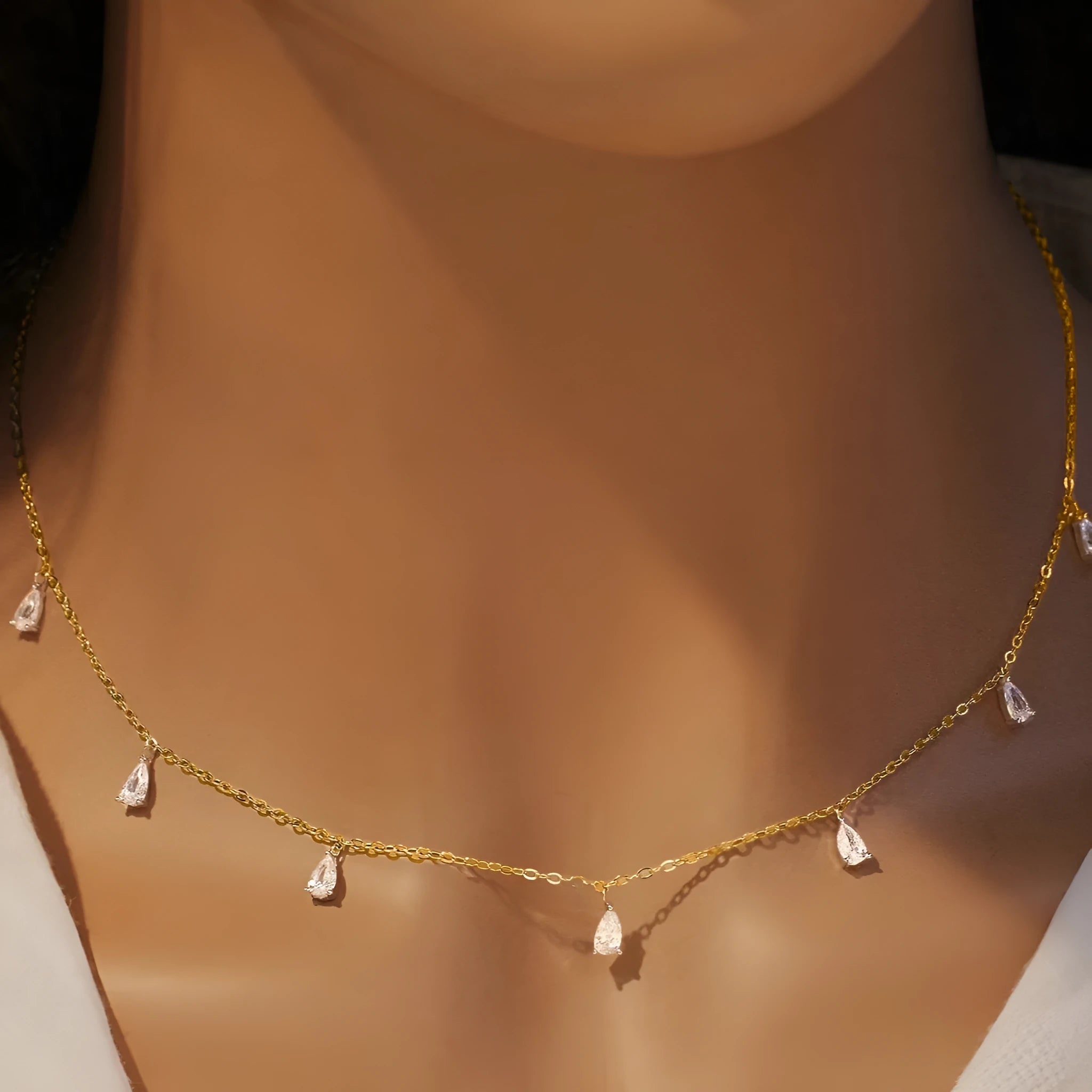 925 silver drop-shaped artificial zircon necklace on an adjustable O-chain, shown in silver, rose gold, and golden yellow finishes.