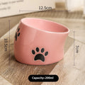 Ceramic cat food bowl with high foot and cat's paw pattern in chosen colour