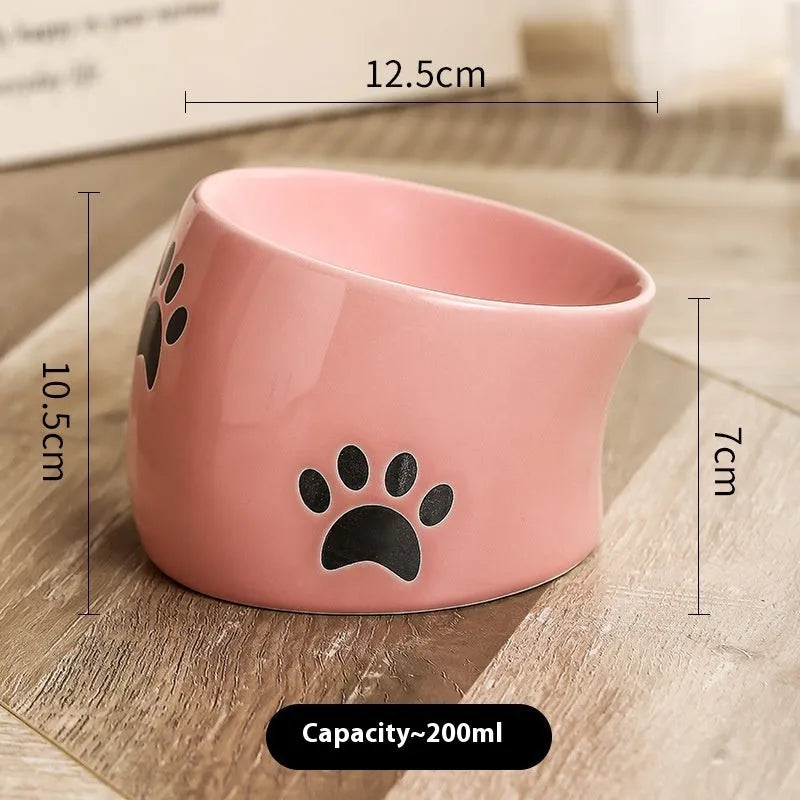 Ceramic cat food bowl with high foot and cat's paw pattern in chosen colour
