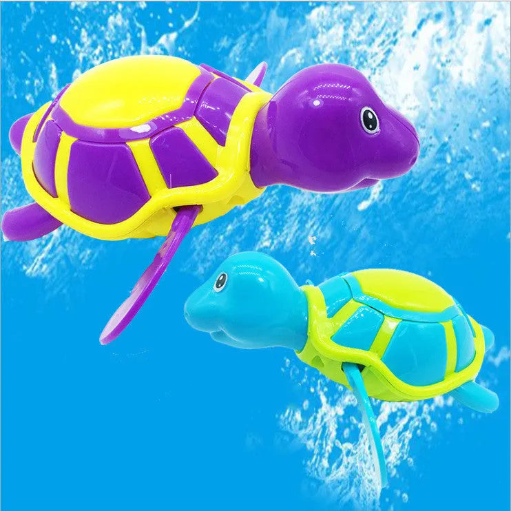 Plastic swimming turtle bath toy with brain game component for baby water play