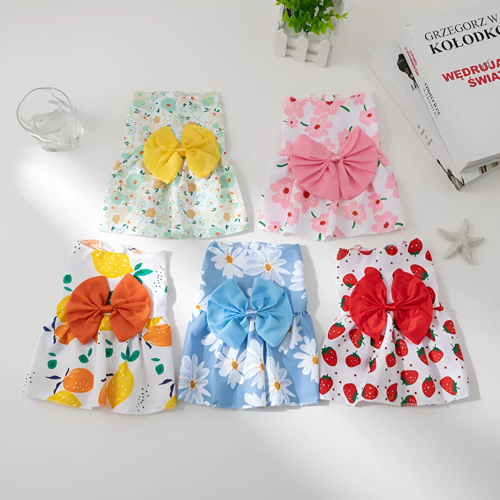 Lightweight floral butterfly princess dress for dog or cat with a decorative bow on the chest.