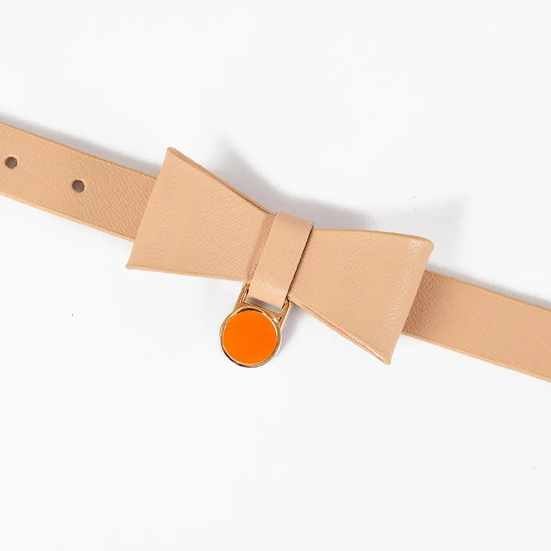 Brown leather cat collar showing buckle and adjustment holes on a neutral background