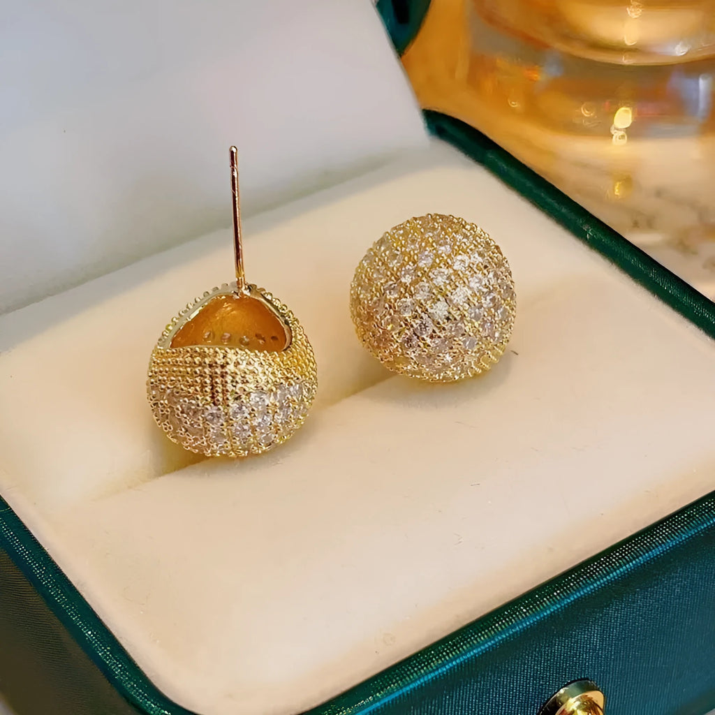 Golden beans shaped clip earrings with diamond crystals in drop geometric design