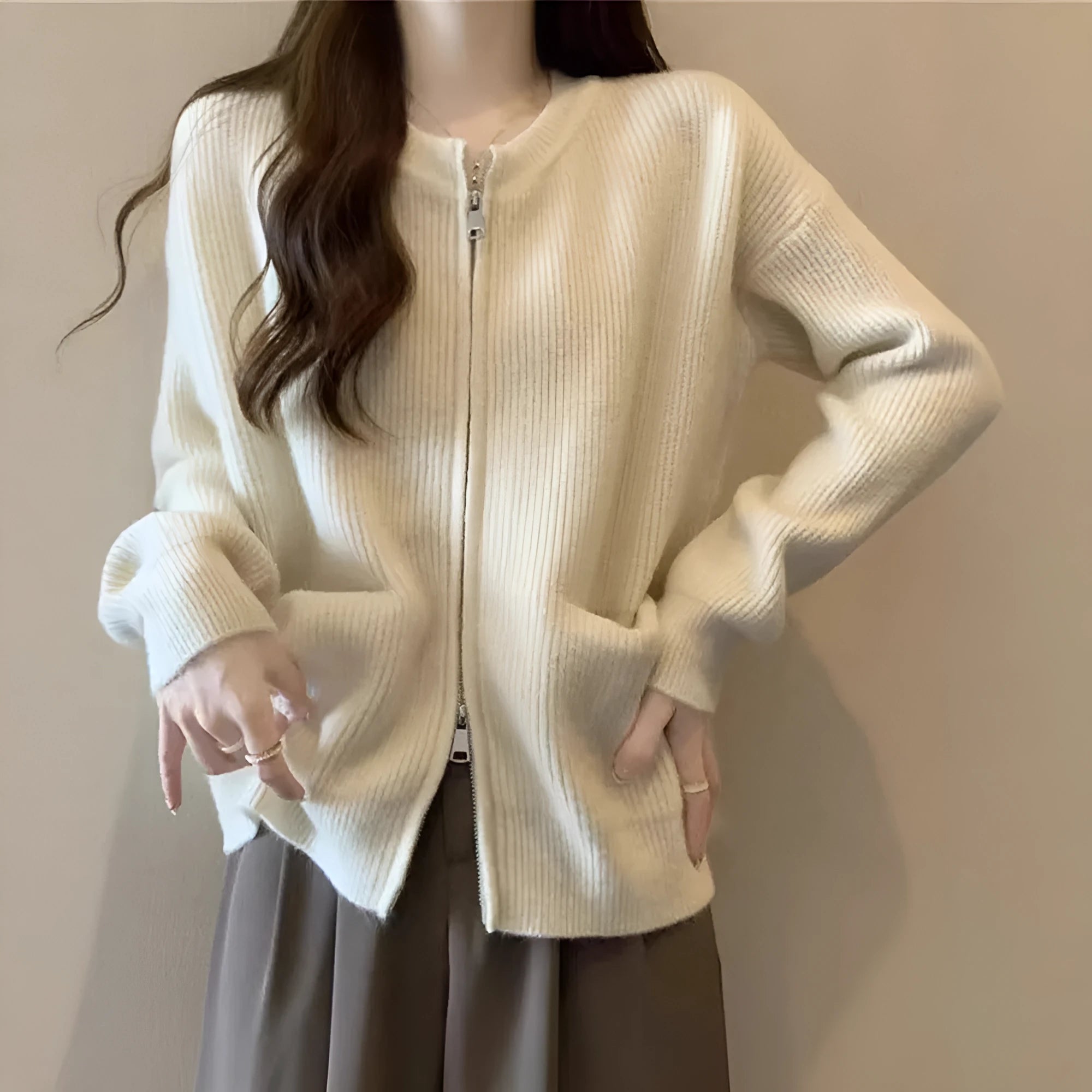 Beige viscose fibre soft sweater coat with long sleeves and open cardigan front.