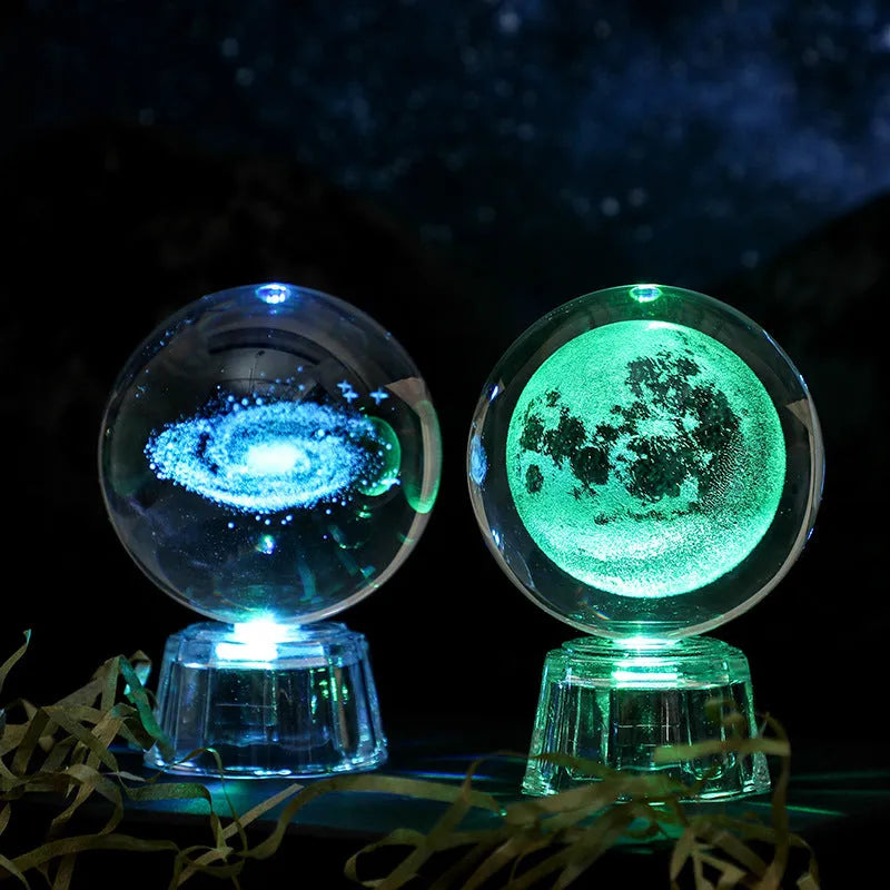 Transparent white luminous crystal ball ornament with inner carving on a fixed base for tabletop decor.