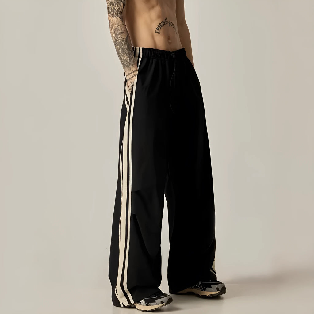 Black men's wide leg high-waist trousers with a straight-leg cut for summer casual wear.