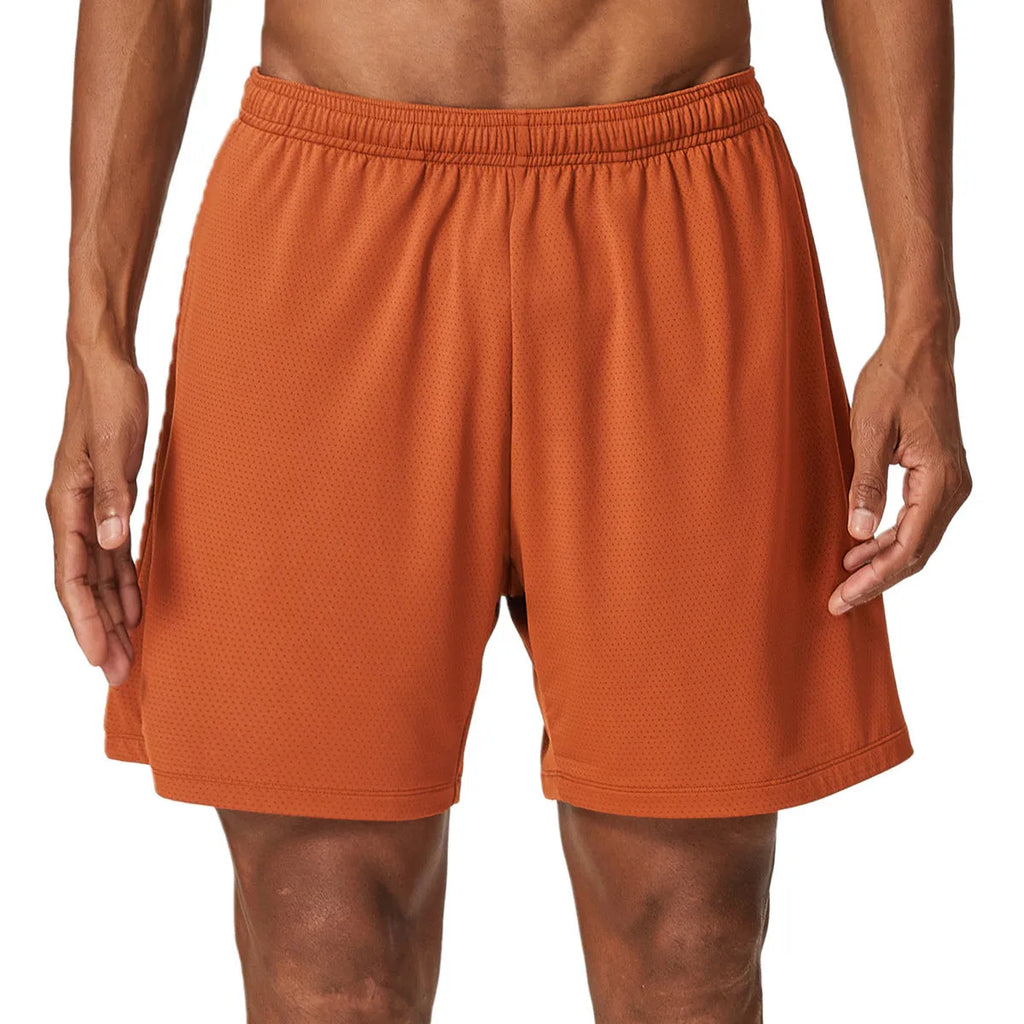 Men's double-layer quick-dry running shorts in brick red colour on a mid-waist fit model.