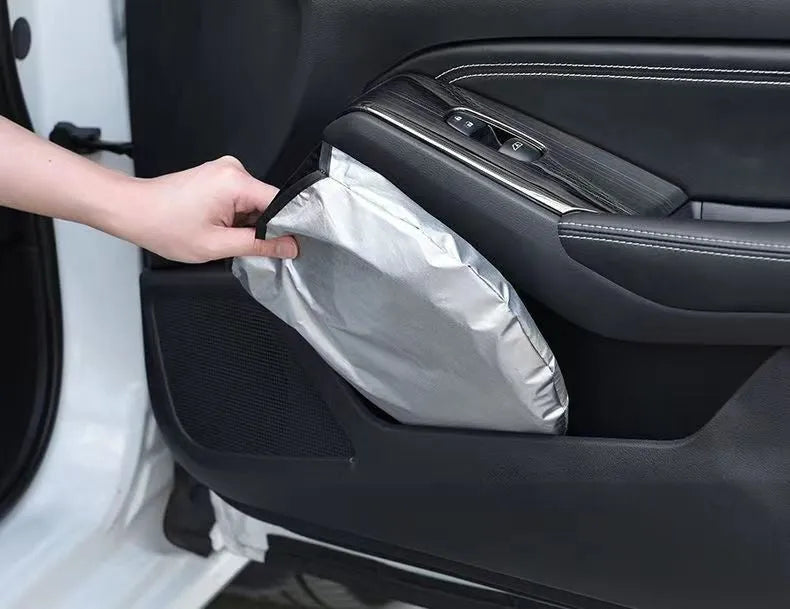 Aluminium foil car sunshade showing titanium silver colour, folded concertina-style.