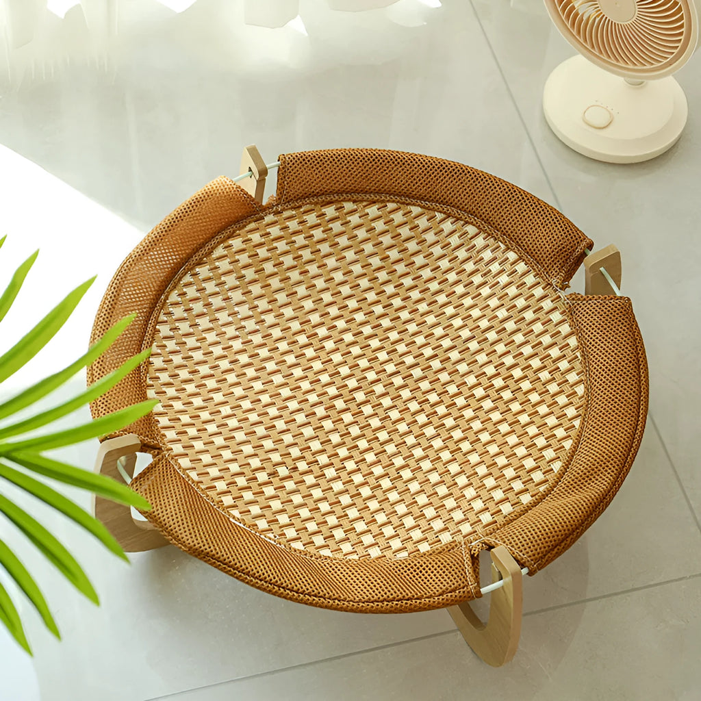 Brown woven rattan pet hammock bed with a cool mat for cats and small dogs.