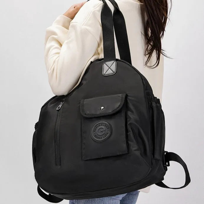 Large lightweight outdoor backpack in nylon, showing sandwich pocket, in black, khaki, or green letter print colours.