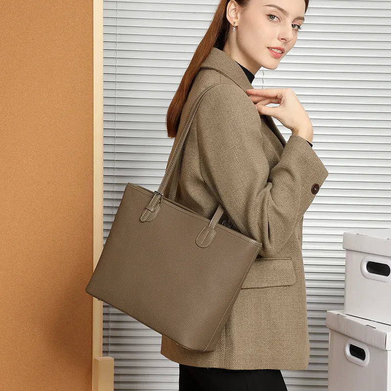 Genuine leather women's retro tote bag in dark grey showing internal zipper and phone pockets