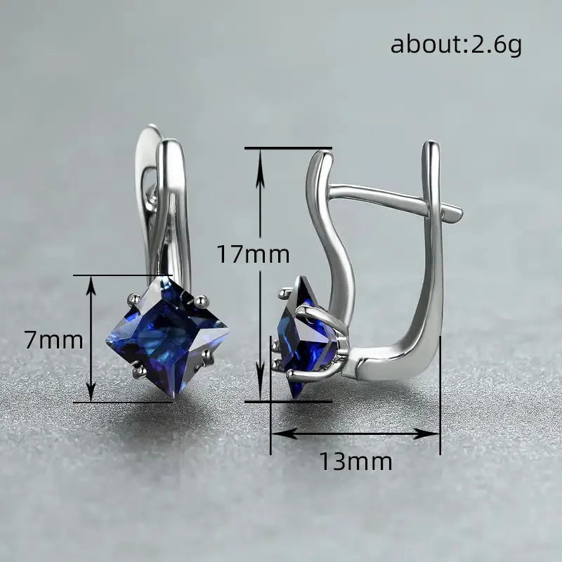 Women's copper diamond design earrings with inlaid zircon detail in blue, green, and colour variations.