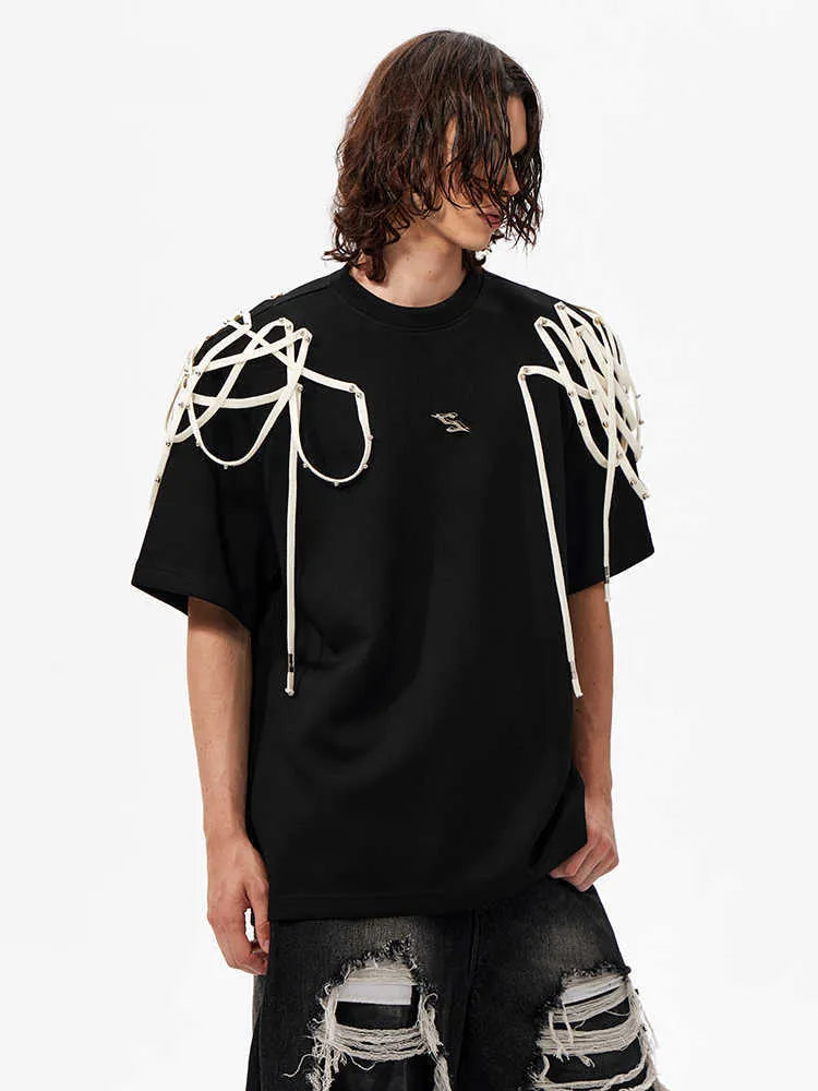Black short-sleeved T-shirt with padded shoulders and rivet ribbon detail, loose fit with round neck