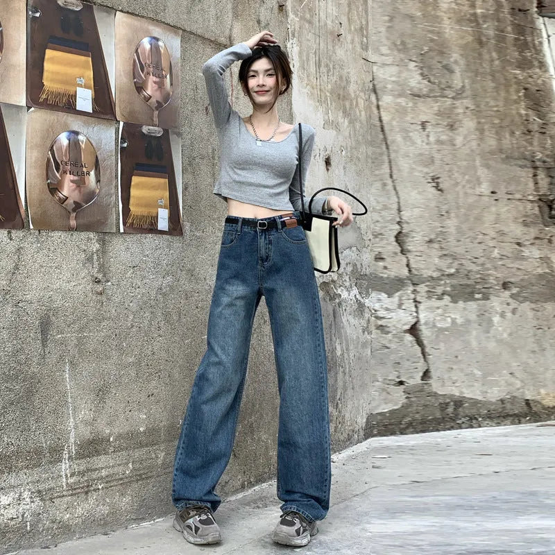 Women's high waist straight leg jeans in retro blue colour on a hanger.