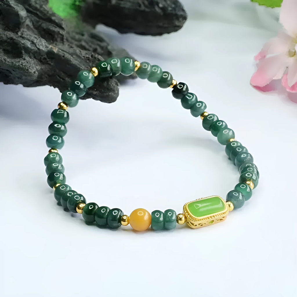 Close-up of a women's bracelet with blue water jade abacus beads in oval and round shapes on an adjustable band.