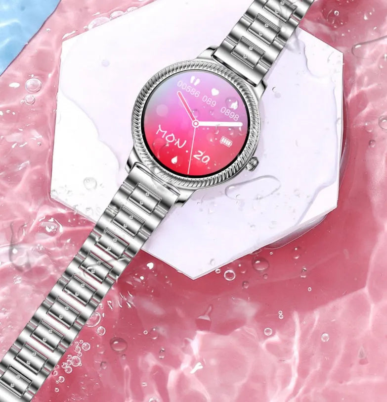 AK38 ladies smart watch with colour screen and stainless steel Milanese strap on a wrist.