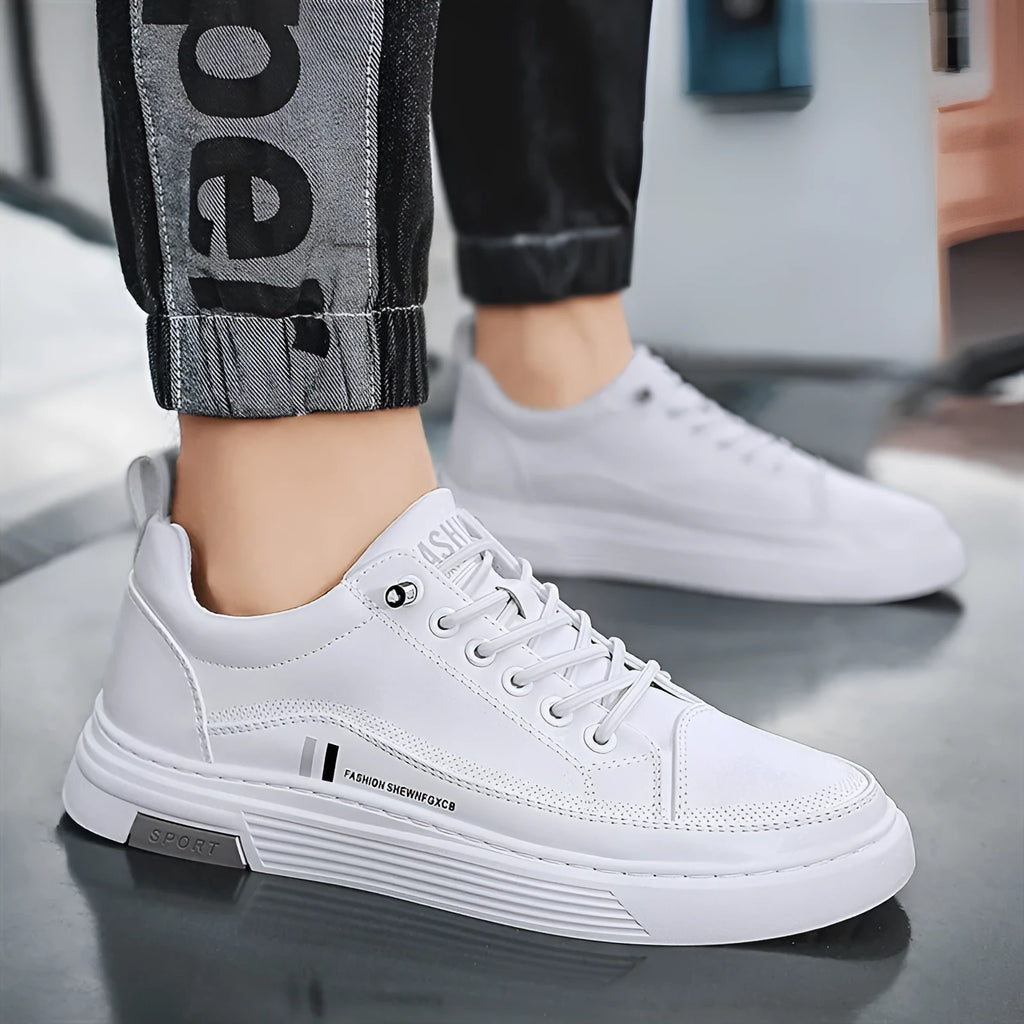 Men's white and black low-top skate shoes with elastic band and round toe.