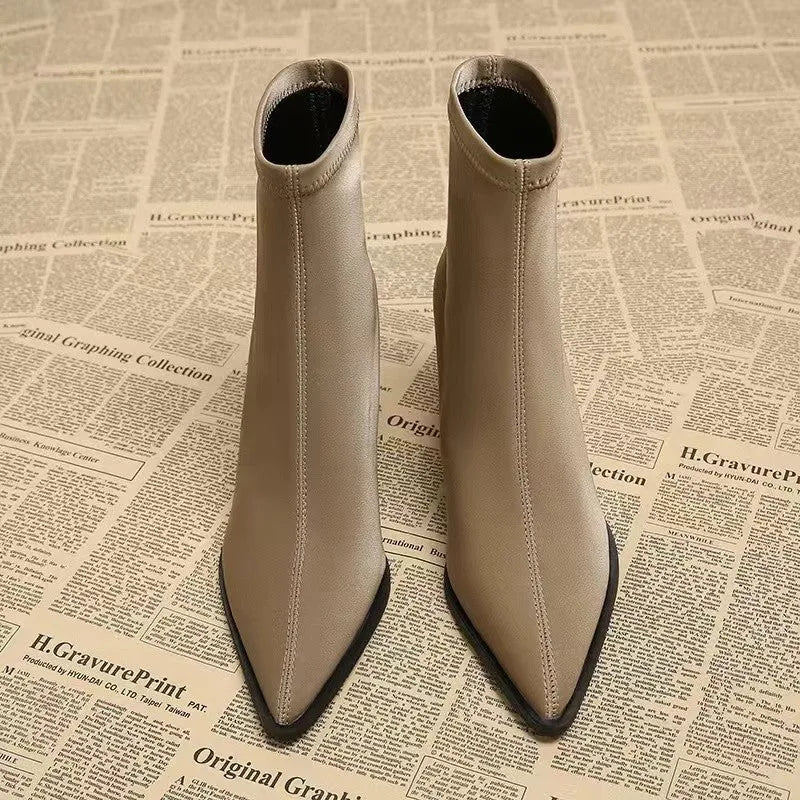 Women's pointed toe boots in stretch artificial suede with mid-heel wedge design