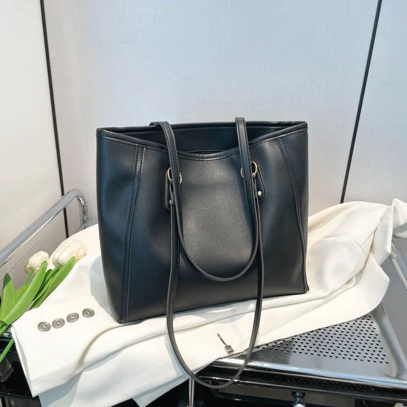 PU leather contrast colour tote bag with horizontal square shape and outer slit pocket.