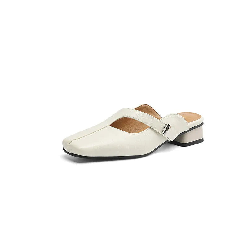 A pair of casual square-toe low-heel slippers in a solid colour on a rubber sole.