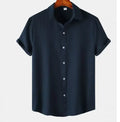 Man wearing a casual short-sleeve polyester shirt in a cardigan style, available in various colours and sizes.