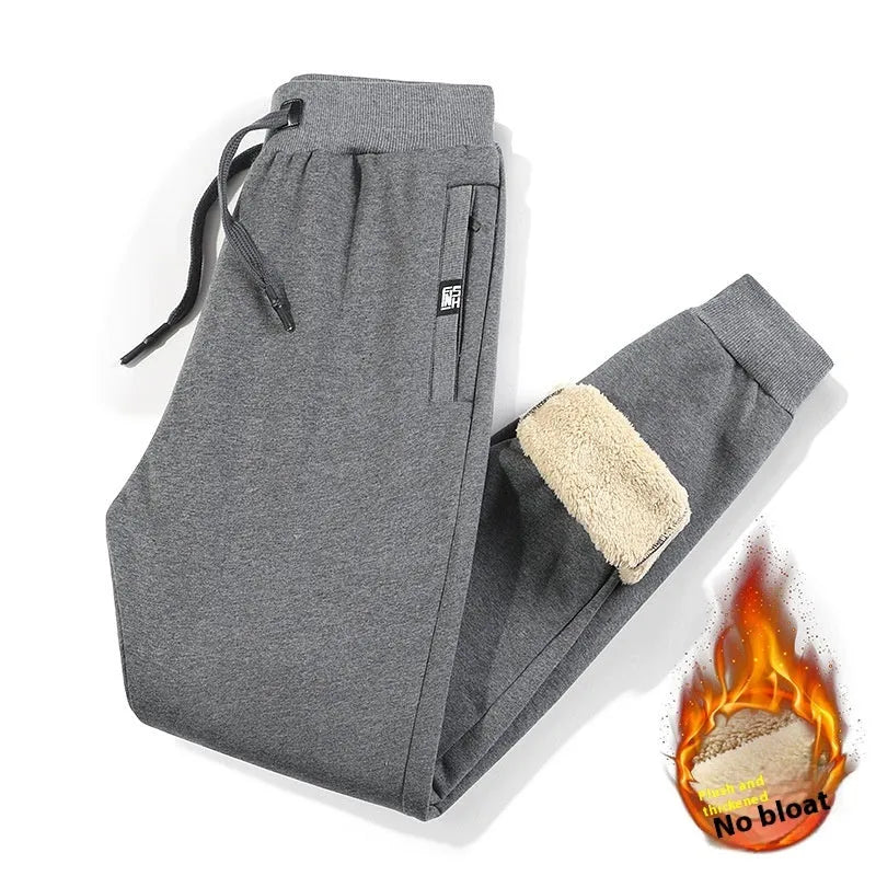 Men's black fleece-lined oversized track pants with drawstring ankles