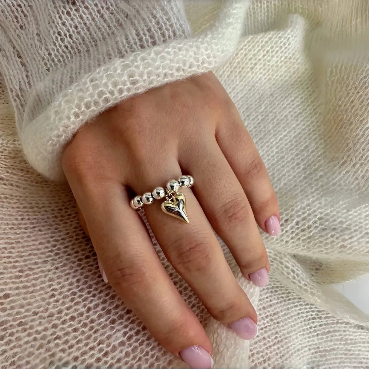 Handmade elastic love ring with geometric heart charm on beaded string