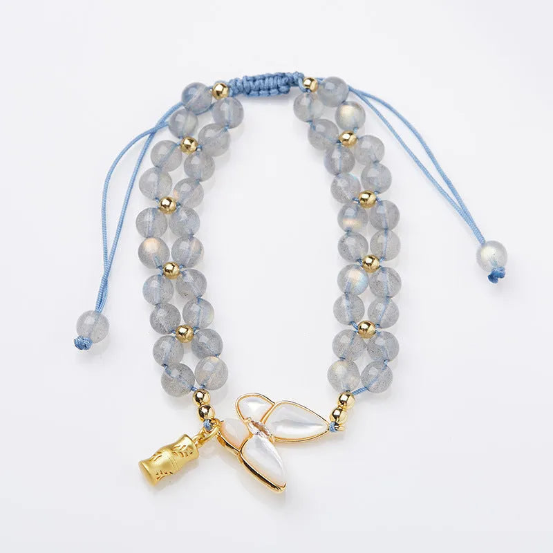 Handwoven women's bracelet with grey moonstone butterfly centrepiece on geometric design