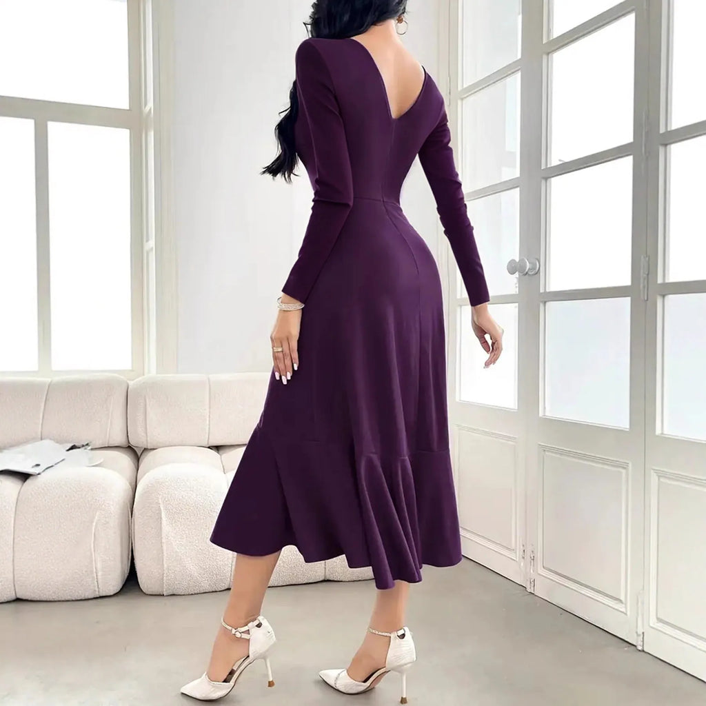 Purple women's long sleeve pullover dress with ruffled detail on a mid waist.