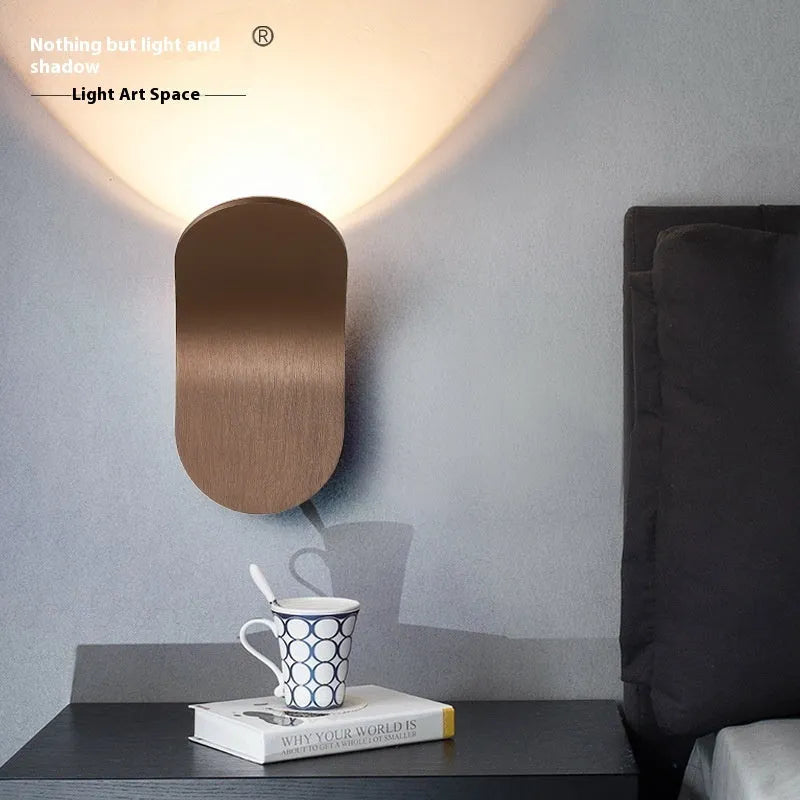 Modern brushed metal wall lamp in gold finish with contemporary design for accent lighting