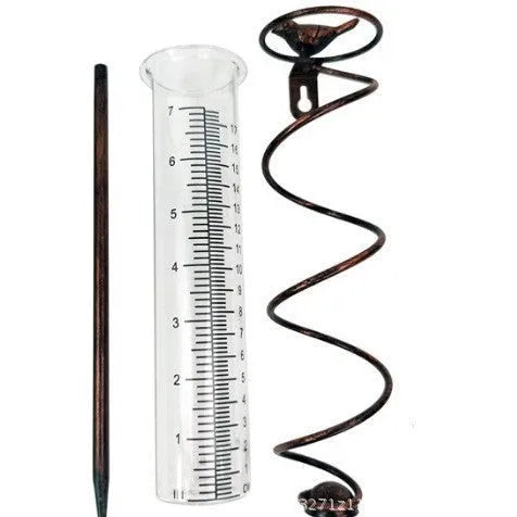 Cast iron outdoor rain gauge with hummingbird decoration and glass measurement tube showing 0-800ml scale.
