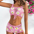 Light green flower vest bikini swimsuit set with matching pants on a mannequin