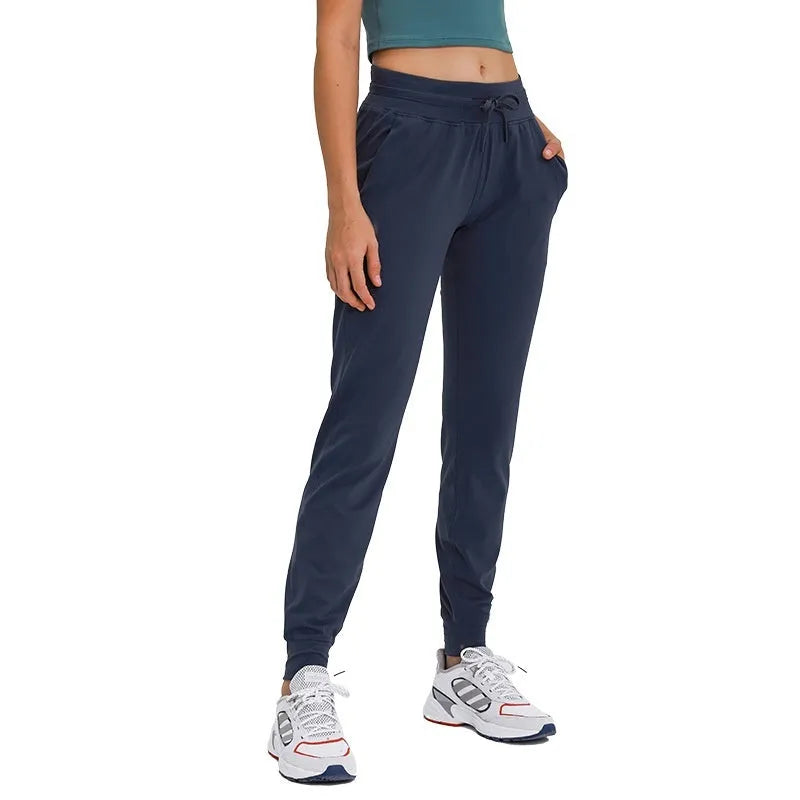 Women's high-waist yoga pants with a drawstring, shown in distilled coffee colour.