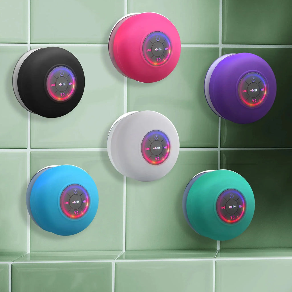 Large white waterproof Bluetooth speaker with a suction cup base and built-in LED light