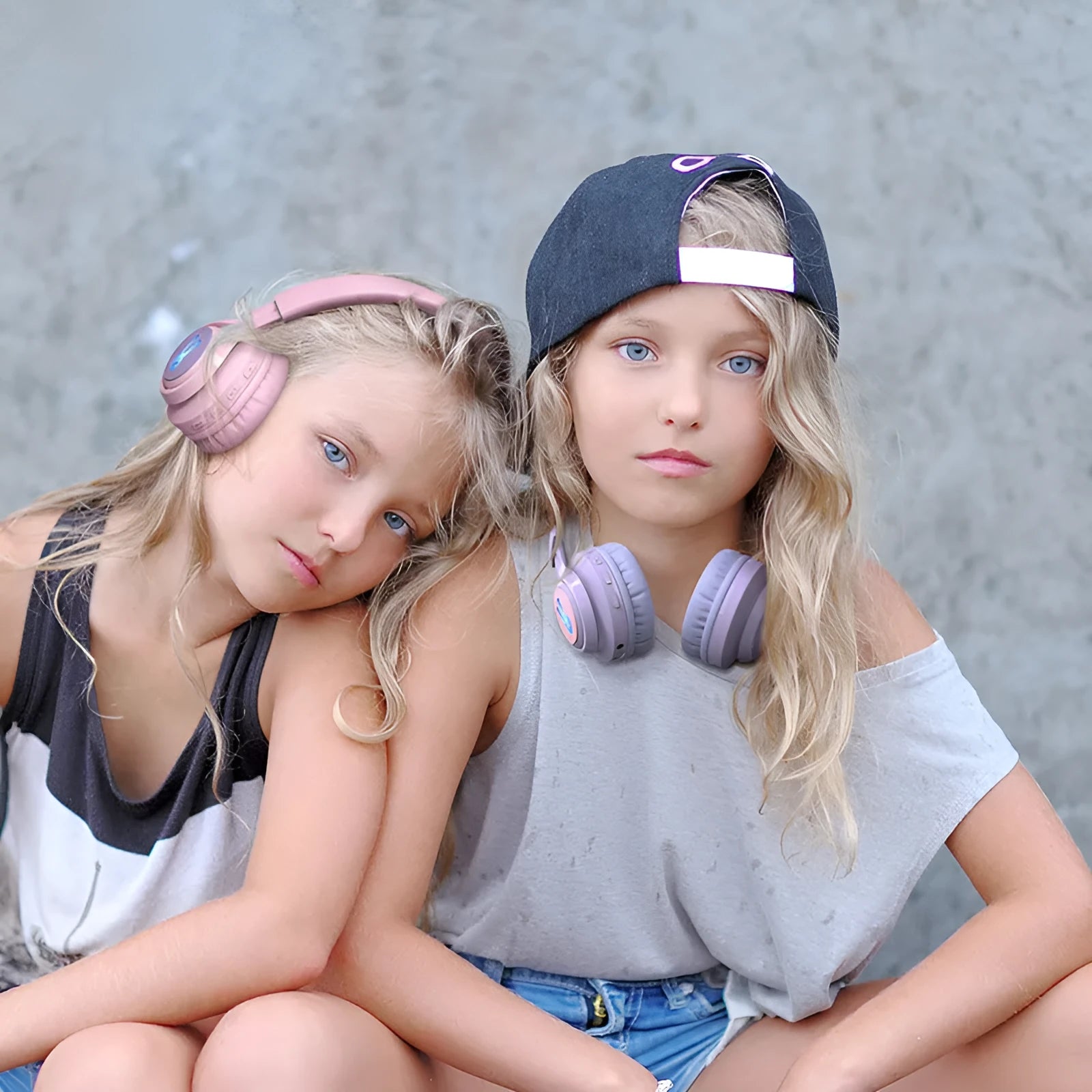 Wireless children's headphones with RGB LED lights in bunny pink colour showing illuminated ear cups