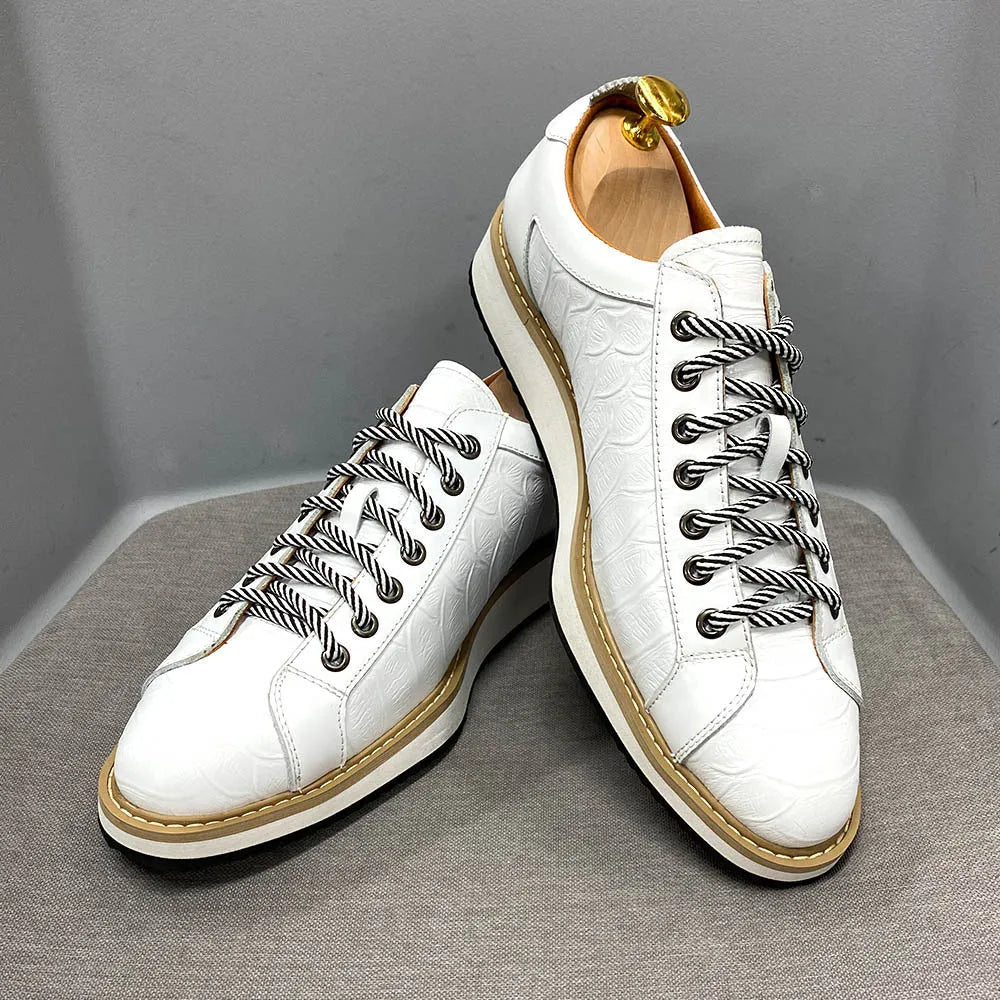 Low tube handmade men's shoes with an embossed pattern, shown in black with front-tie laces.