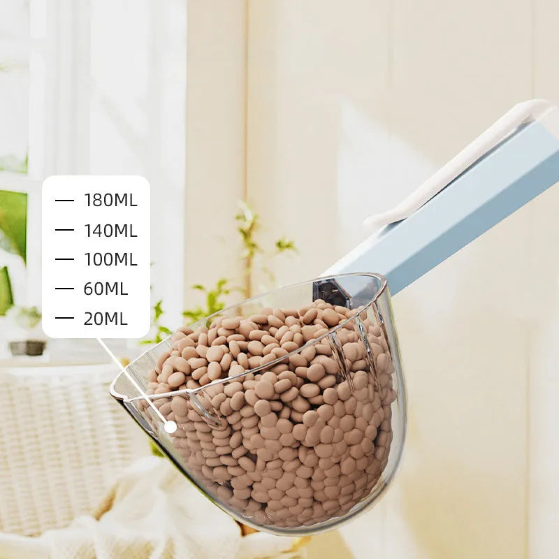 Blue plastic pet food spoon with an attached clip for sealing dog or cat food bags.