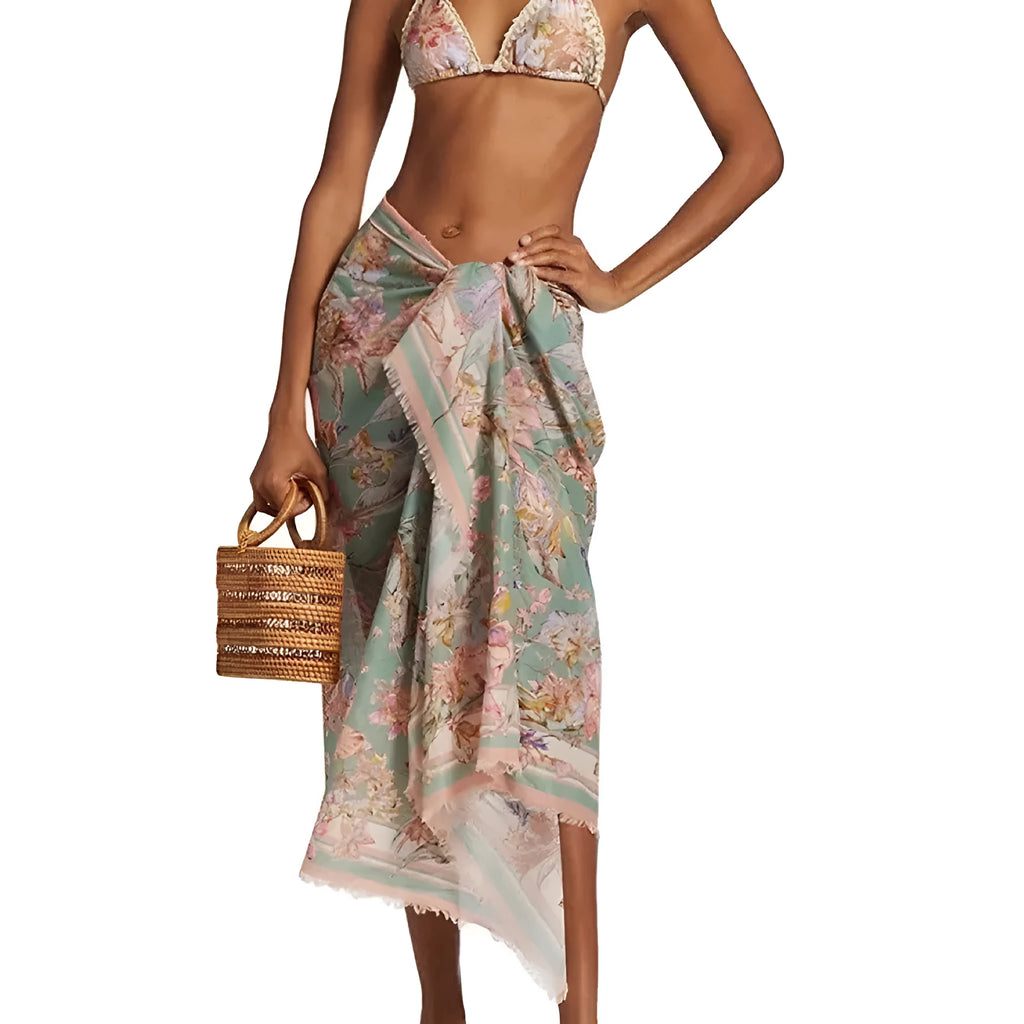 Women's floral print bikini set with top, briefs, and removable skirt in creamy-white colour