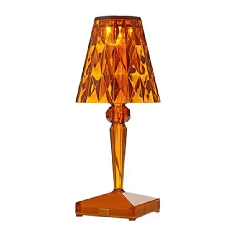 Rose gold portable touch control bedside night light on a wooden surface