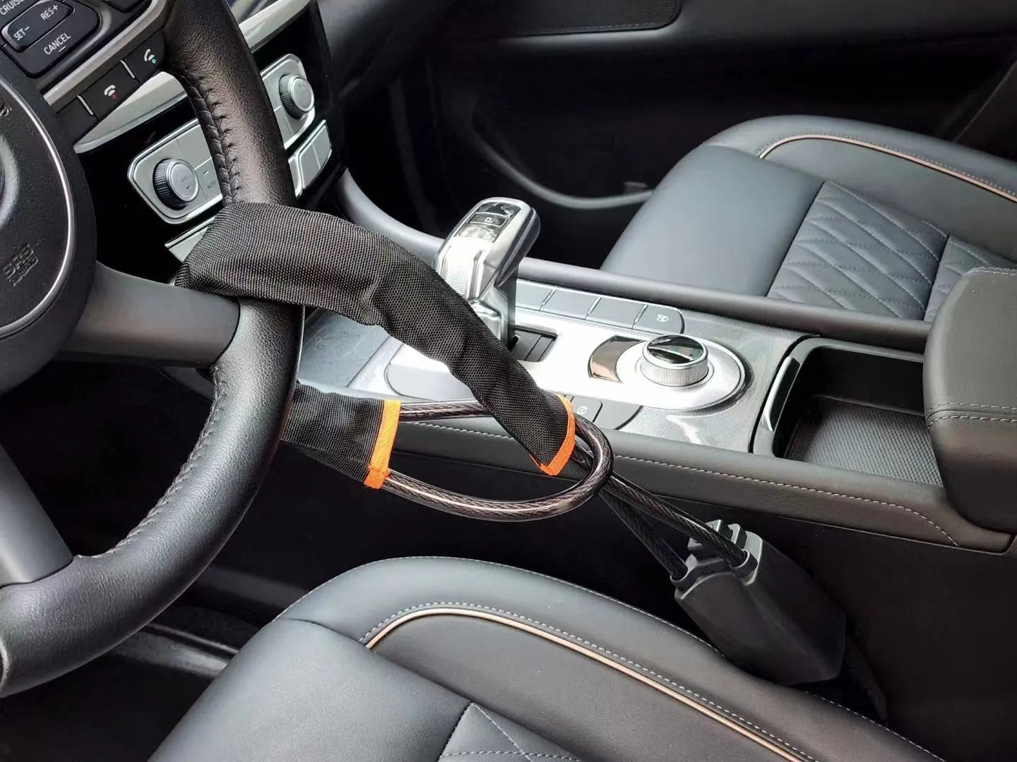 Red iron wire rope car steering wheel lock with key for General Motors vehicles.