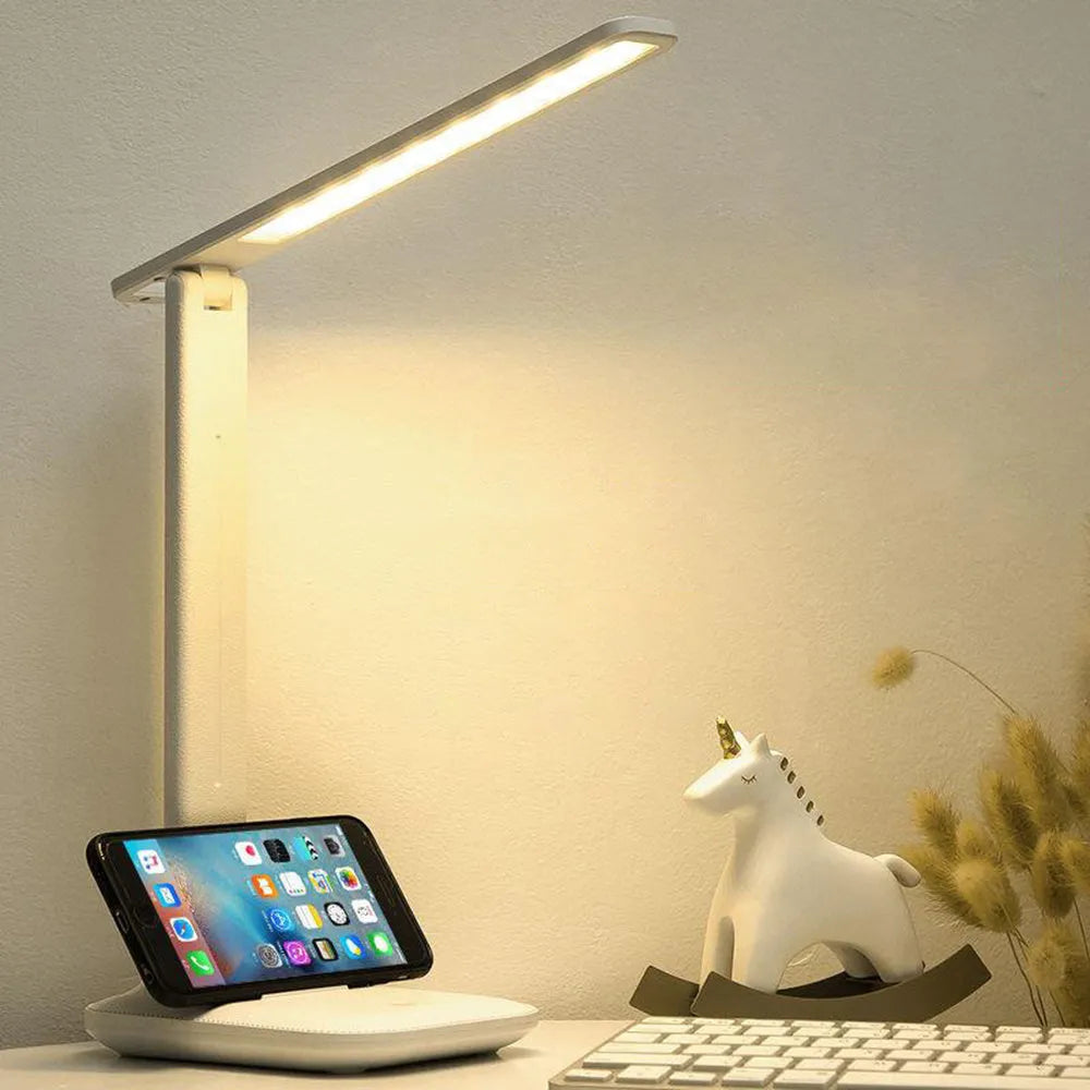 White plastic bedside table lamp with touch dimming and USB charging port.