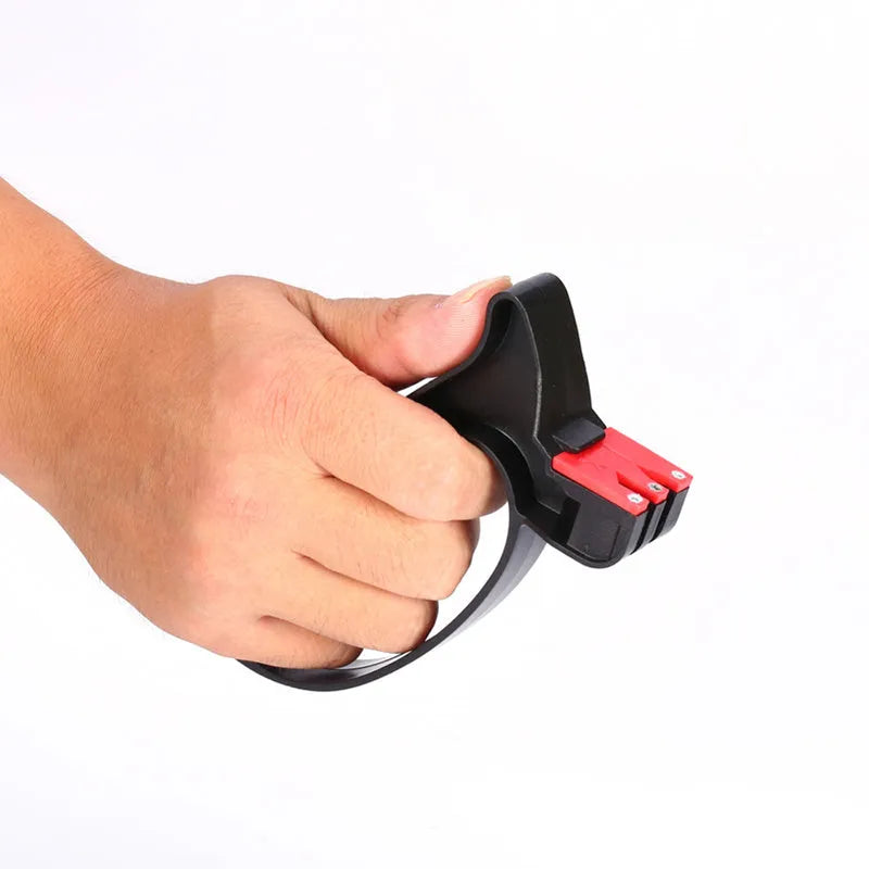Black handheld knife and scissor sharpener tool on a white background.