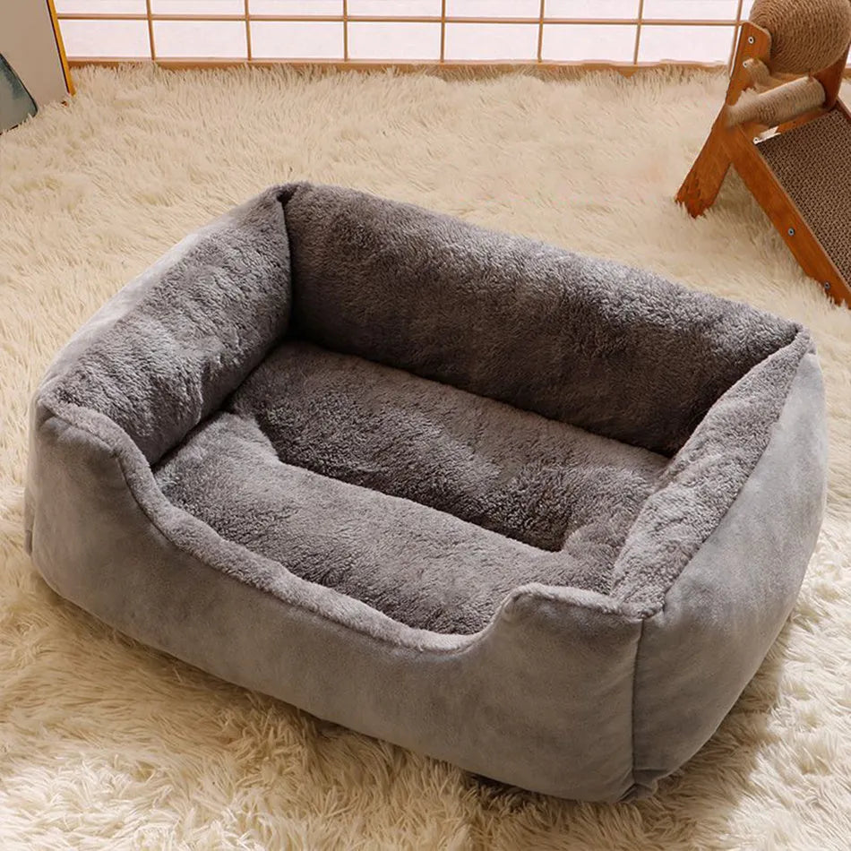 Soft plush cat bed cushion shown in grey, available in five sizes from small to extra extra large.