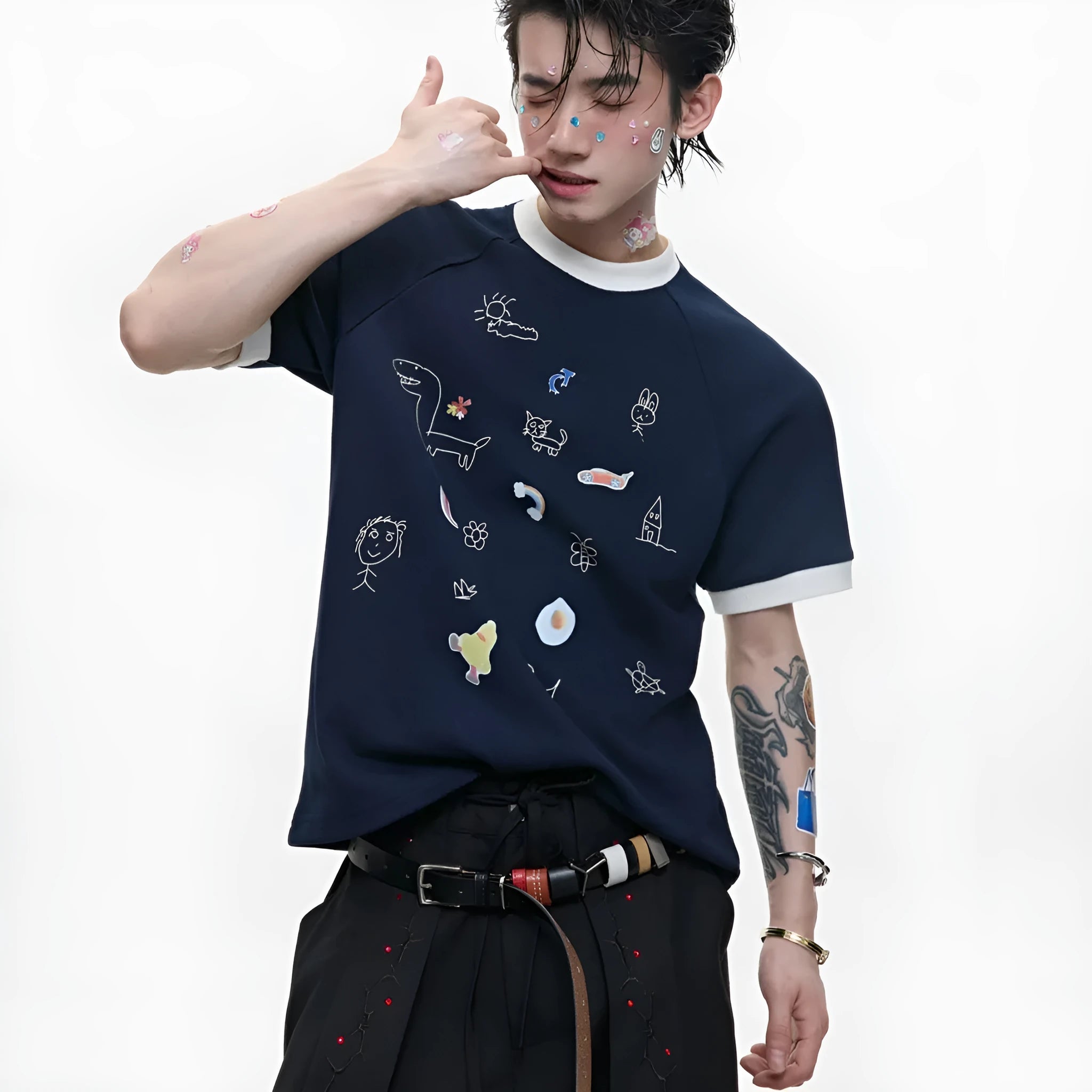 Man wearing a blue short sleeve shirt with a cartoon print design and loose fit