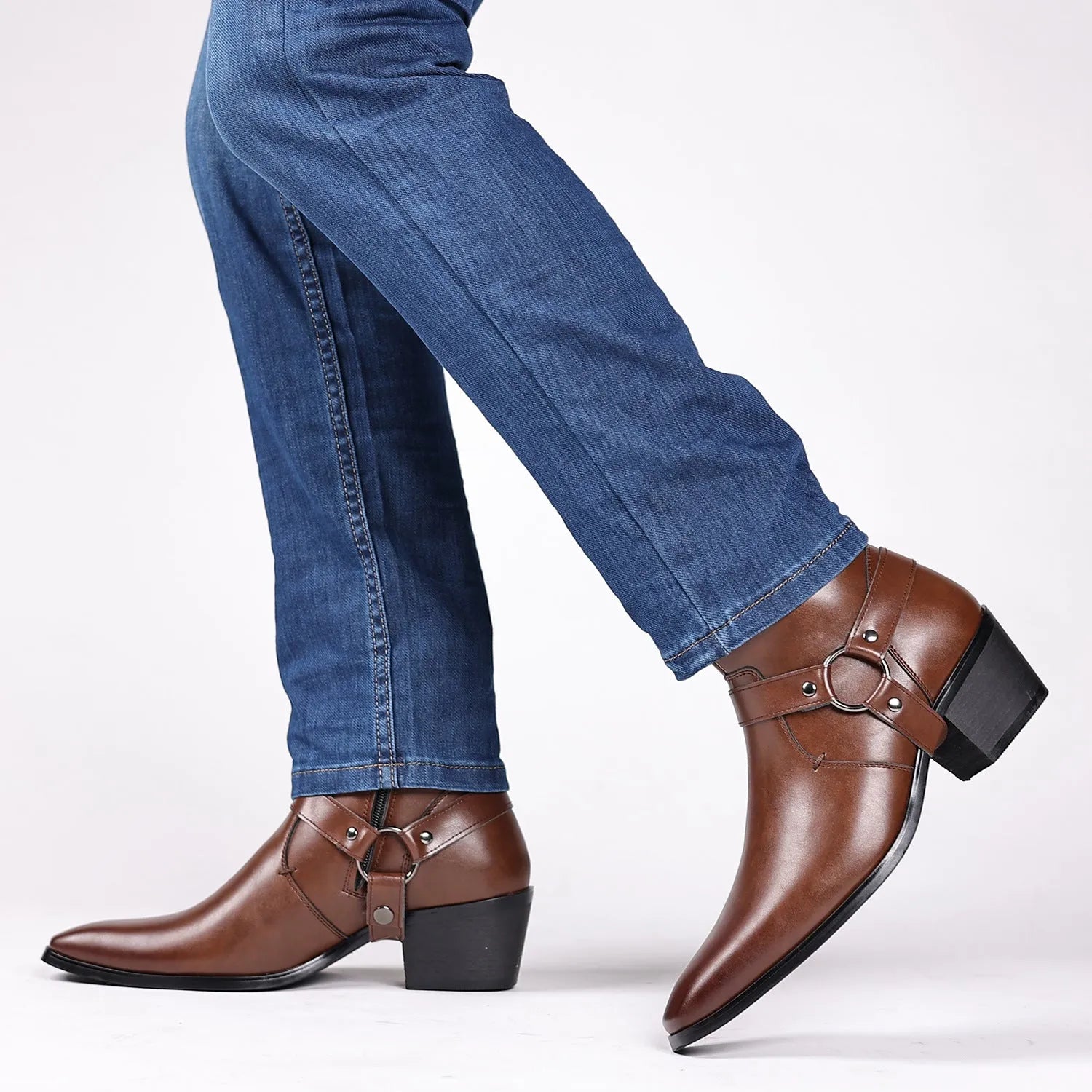 Side view of a black unisex boot with a square toe, side zip, and decorative rivets on a block heel.