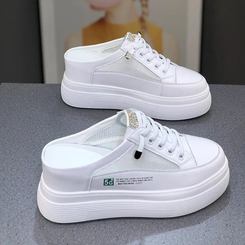 Women's white platform shoes with mesh surface detail and rounded toe