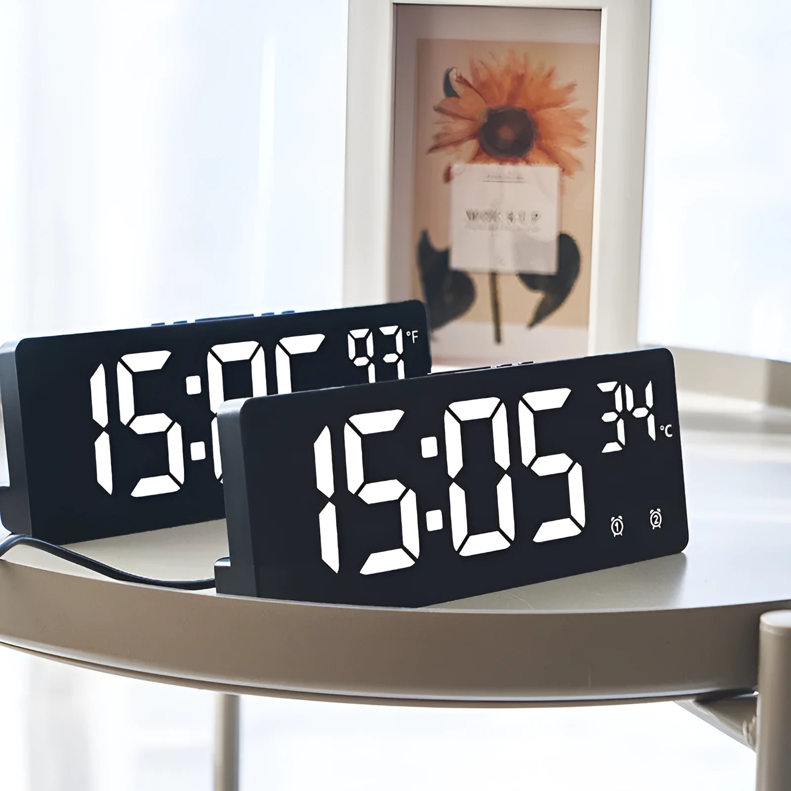Electronic LED alarm clock with large digital display showing time and temperature, in acrylic blue and white colour.