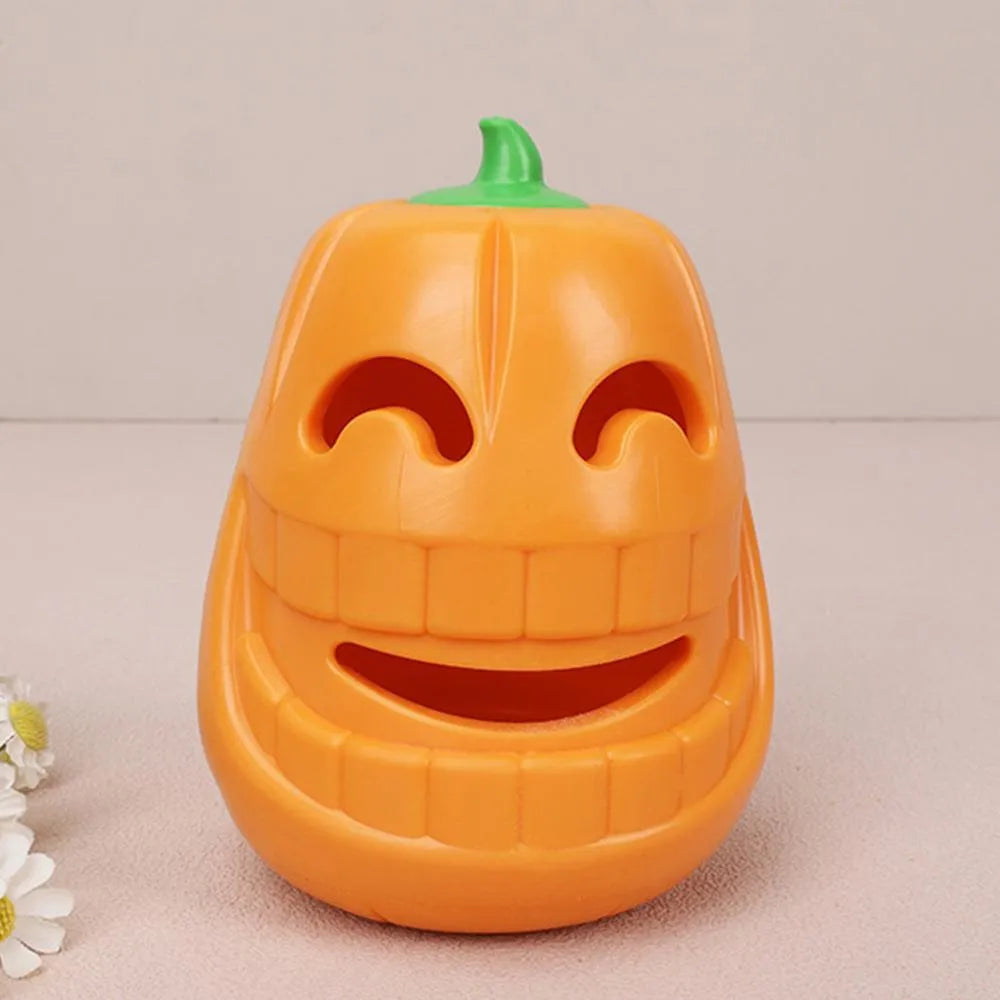 Yellow pumpkin-shaped TPR dog chew toy for aggressive chewers on a white background.